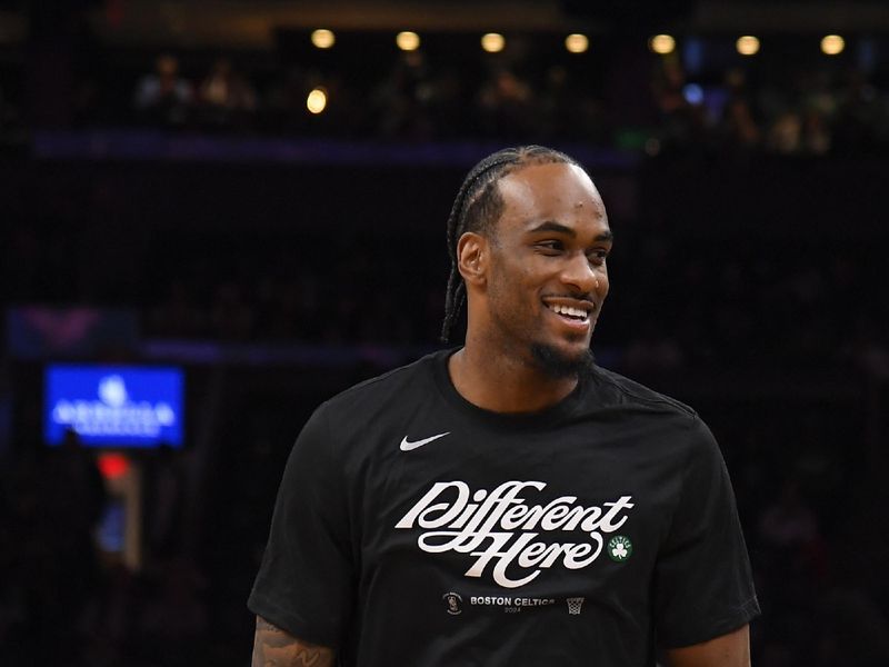 BOSTON, MA - APRIL 24: Oshae Brissett #12 of the Boston Celtics looks on before the game against the Miami Heat  during Round 1 Game 2 of the 2024 NBA Playoffs on April 24, 2024 at the TD Garden in Boston, Massachusetts. NOTE TO USER: User expressly acknowledges and agrees that, by downloading and or using this photograph, User is consenting to the terms and conditions of the Getty Images License Agreement. Mandatory Copyright Notice: Copyright 2024 NBAE  (Photo by Brian Babineau/NBAE via Getty Images)