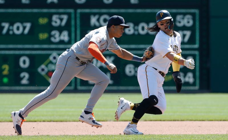 Apr 12, 2023; Pittsburgh, Pennsylvania, USA;  Houston Astros shortstop Jeremy Pena (3) (left) tags Pittsburgh Pirates first baseman Connor Joe (2) (right) out between first and second base in a caught stealing run down during the fourth inning at PNC Park. Mandatory Credit: Charles LeClaire-USA TODAY Sports