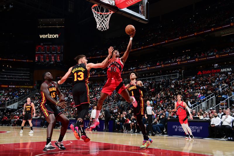 ATLANTA, GA - February 23:  Ochai Agbaji #30 of the Toronto Raptors drives to the basket during the game against the Atlanta Hawks on February 23, 2024 at State Farm Arena in Atlanta, Georgia.  NOTE TO USER: User expressly acknowledges and agrees that, by downloading and/or using this Photograph, user is consenting to the terms and conditions of the Getty Images License Agreement. Mandatory Copyright Notice: Copyright 2024 NBAE (Photo by Scott Cunningham/NBAE via Getty Images)