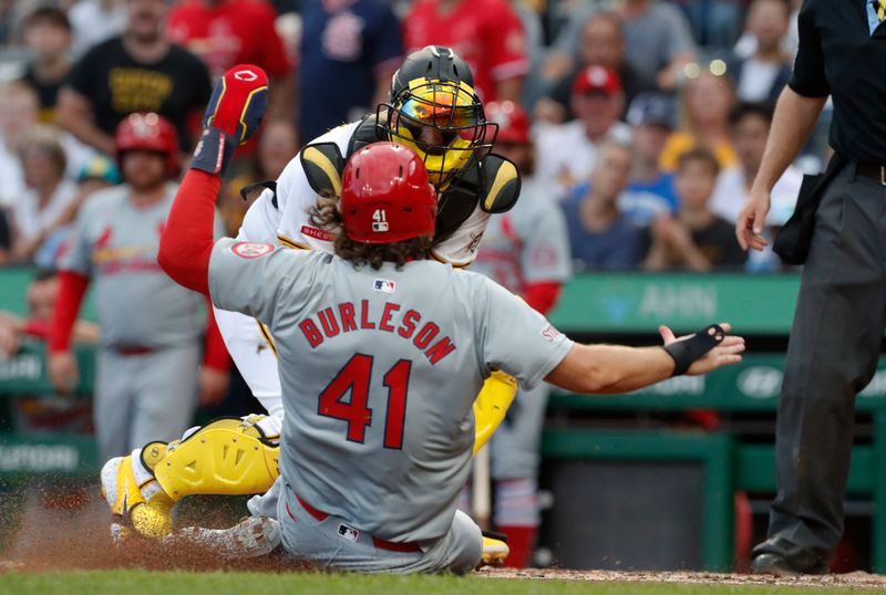 Jul 2, 2024; Pittsburgh, Pennsylvania, USA;  St. Louis Cardinals outfielder Alec Burleson (41) is tagged out at home plate attempting to score a run by Pittsburgh Pirates catcher Yasmani Grandal (rear) to end the fourth inning at PNC Park. Mandatory Credit: Charles LeClaire-USA TODAY Sports