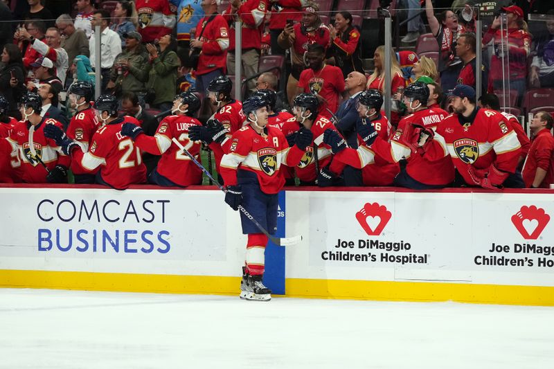 Nov 10, 2023; Sunrise, Florida, USA; Florida Panthers left wing Matthew Tkachuk (19) celebrates with teammates after scoring a goal against the Carolina Hurricanes during the first period at Amerant Bank Arena. Mandatory Credit: Jasen Vinlove-USA TODAY Sports