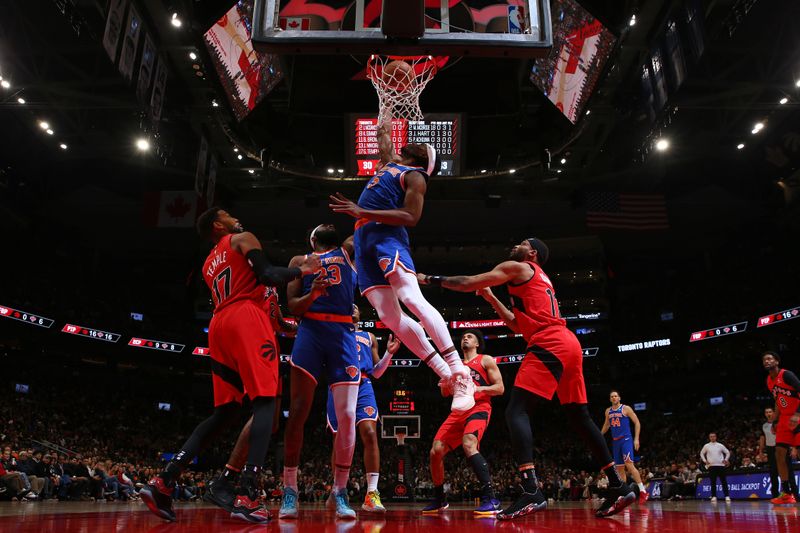 TORONTO, CANADA - MARCH 27: Precious Achiuwa #5 of the New York Knicks shoots the ball during the game against the Toronto Raptors on March 27, 2024 at the Scotiabank Arena in Toronto, Ontario, Canada.  NOTE TO USER: User expressly acknowledges and agrees that, by downloading and or using this Photograph, user is consenting to the terms and conditions of the Getty Images License Agreement.  Mandatory Copyright Notice: Copyright 2024 NBAE (Photo by Vaughn Ridley/NBAE via Getty Images)