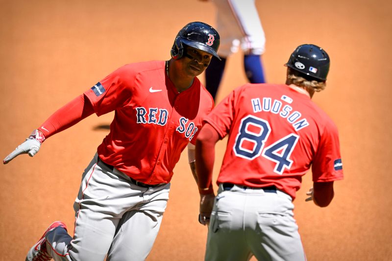 Mar 26, 2024; Arlington, Texas, USA; Boston Red Sox shortstop Trevor Story (10) rounds the bases after he hits a home run against the Texas Rangers during the first inning at Globe Life Field. Mandatory Credit: Jerome Miron-USA TODAY Sports