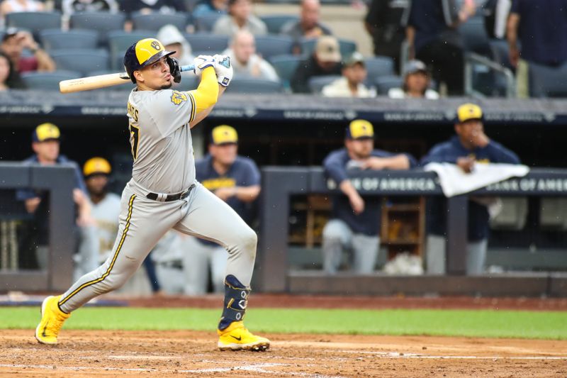 Sep 9, 2023; Bronx, New York, USA;  Milwaukee Brewers right fielder Mark Canha (21) hits an RBI triple in the fourth inning against the New York Yankees at Yankee Stadium. Mandatory Credit: Wendell Cruz-USA TODAY Sports