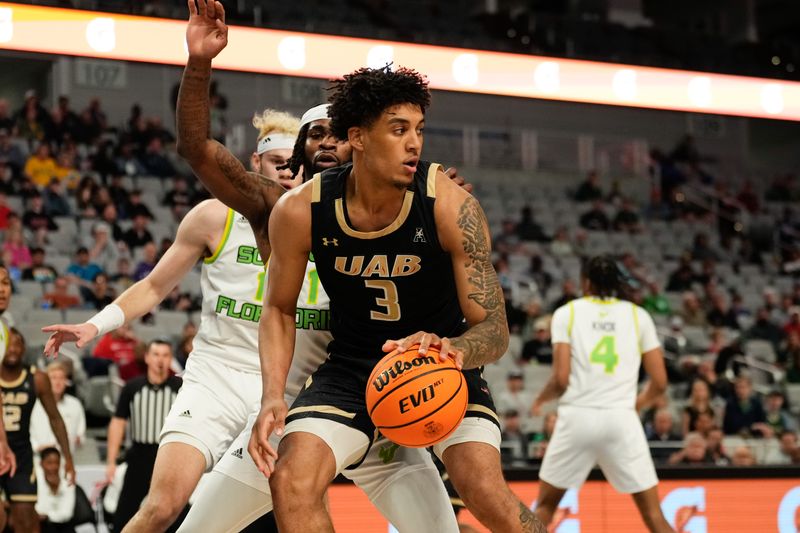 Mar 16, 2024; Fort Worth, TX, USA;  UAB Blazers forward Yaxel Lendeborg (3) controls the ball against South Florida Bulls guard Selton Miguel (1) during the first half at Dickies Arena. Mandatory Credit: Chris Jones-USA TODAY Sports