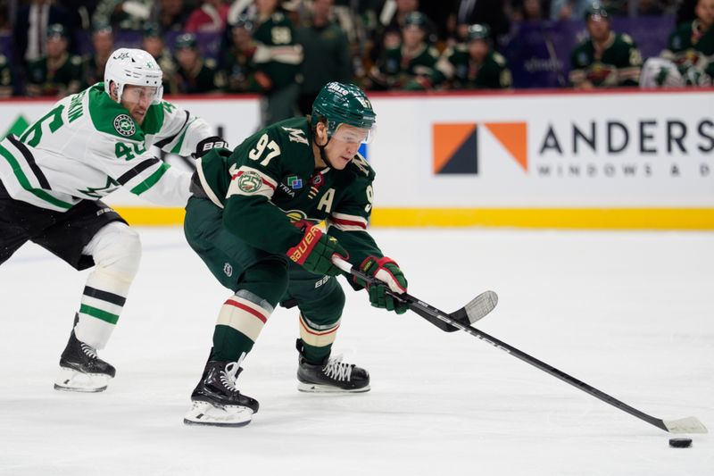 Sep 25, 2025; Saint Paul, Minnesota, USA; Minnesota Wild left wing Kirill Kaprizov (97) on a breakaway is hooked by Dallas Stars defenseman Ilya Lyubushkin (46) in the second period at Grand Casino Arena. Mandatory Credit: Matt Blewett-Imagn Images