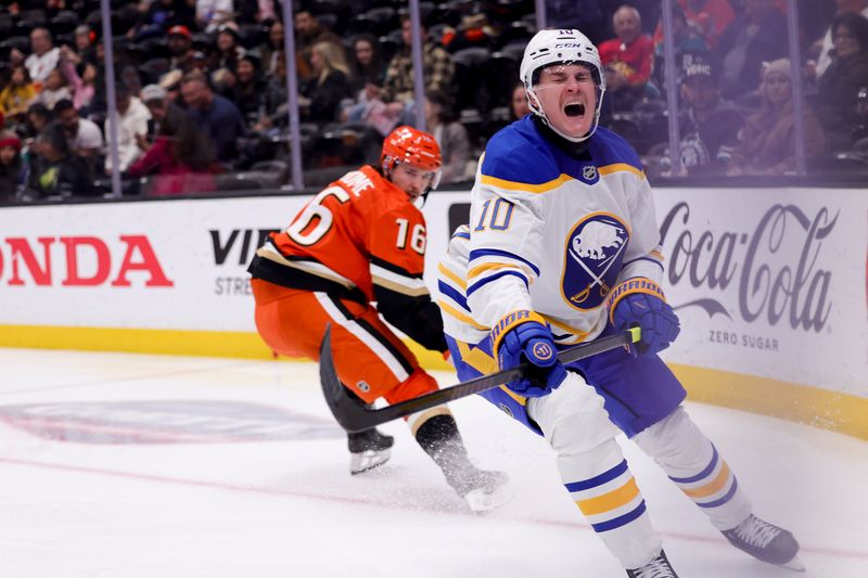 Nov 22, 2024; Anaheim, California, USA; Buffalo Sabres defenseman Henri Jokiharju (10) reacts next to Anaheim Ducks center Ryan Strome (16) during the second period at Honda Center. Mandatory Credit: Ryan Sun-Imagn Images