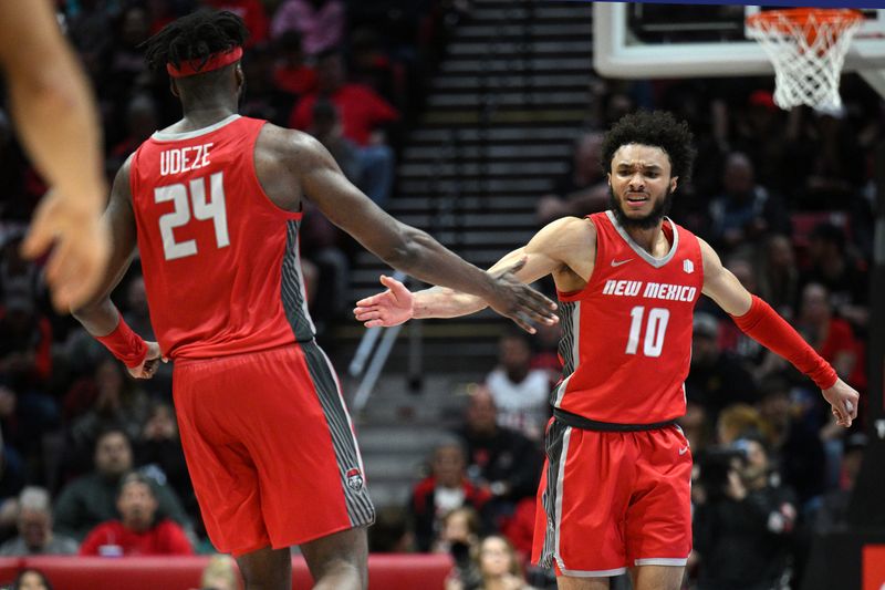 Jan 14, 2023; San Diego, California, USA; New Mexico Lobos guard Jaelen House (10) celebrates with forward Morris Udeze (24) after a basket against the San Diego State Aztecs during the second half at Viejas Arena. Mandatory Credit: Orlando Ramirez-USA TODAY Sports