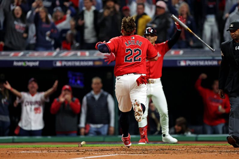 Oct 19, 2024; Cleveland, Ohio, USA; Cleveland Guardians first base Josh Naylor (22) scores a run during the second inning against the New York Yankees during game five of the ALCS for the 2024 MLB playoffs at Progressive Field. Mandatory Credit: Scott Galvin-Imagn Images