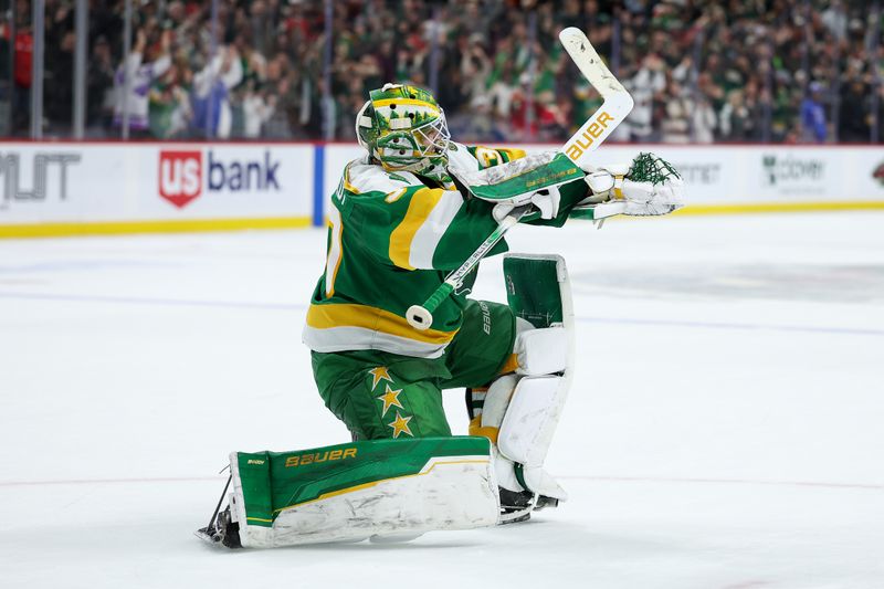 Jan 27, 2026; Saint Paul, Minnesota, USA; Minnesota Wild goaltender Jesper Wallstedt (30) celebrates his teams shootout win against the Chicago Blackhawks at Grand Casino Arena. Mandatory Credit: Matt Krohn-Imagn Images