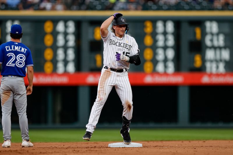 Sep 3, 2023; Denver, Colorado, USA; Colorado Rockies right fielder Hunter Goodman (15) at second on an RBI double in the fourth inning against the Toronto Blue Jays at Coors Field. Mandatory Credit: Isaiah J. Downing-USA TODAY Sports