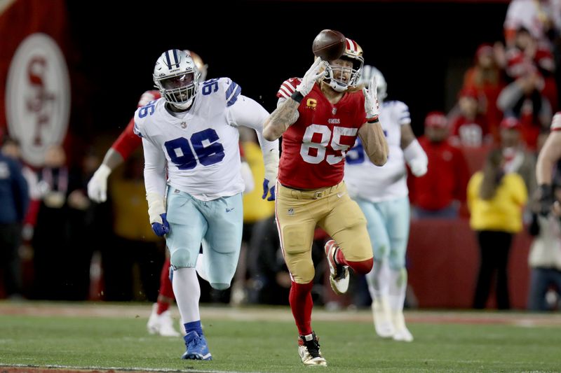 San Francisco 49ers tight end George Kittle (85) makes a catch during an NFL divisional round playoff football game against the Dallas Cowboys, Sunday, Jan. 22, 2023, in Santa Clara, Calif. (AP Photo/Scot Tucker)