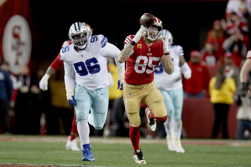 San Francisco 49ers tight end George Kittle (85) makes a catch during an NFL divisional round playoff football game against the Dallas Cowboys, Sunday, Jan. 22, 2023, in Santa Clara, Calif. (AP Photo/Scot Tucker)