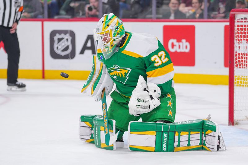 Mar 17, 2025; Saint Paul, Minnesota, USA;  Minnesota Wild goaltender Filip Gustavsson (32) makes a save against the Los Angeles Kings in the first period at Xcel Energy Center. Mandatory Credit: Brad Rempel-Imagn Images