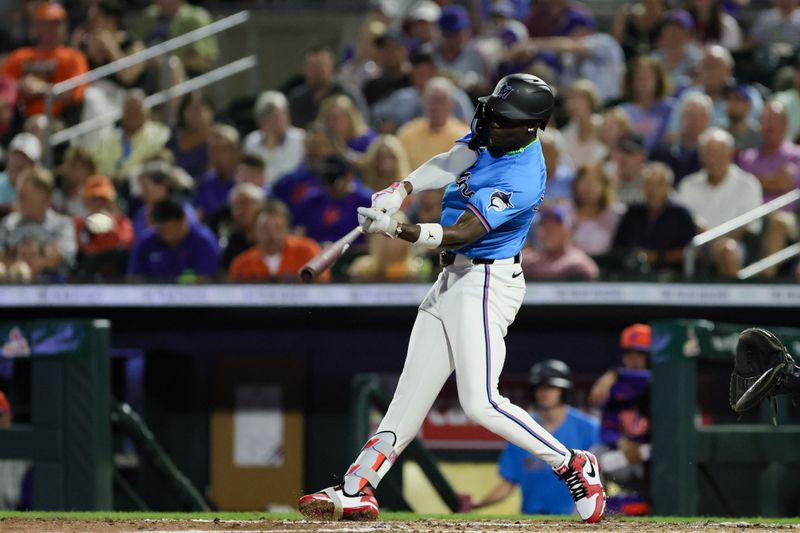 Mar 8, 2024; Jupiter, Florida, USA; Miami Marlins center fielder Jazz Chisholm Jr.(2) hits a single against the New York Mets during the fourth inning at Roger Dean Chevrolet Stadium. Mandatory Credit: Sam Navarro-USA TODAY Sports