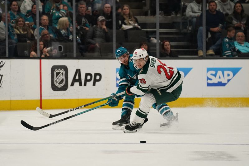 Apr 13, 2024; San Jose, California, USA; Minnesota Wild forward Liam Ohgren (28) controls the puck against the San Jose Sharks during the second period at SAP Center at San Jose. Mandatory Credit: David Gonzales-USA TODAY Sports