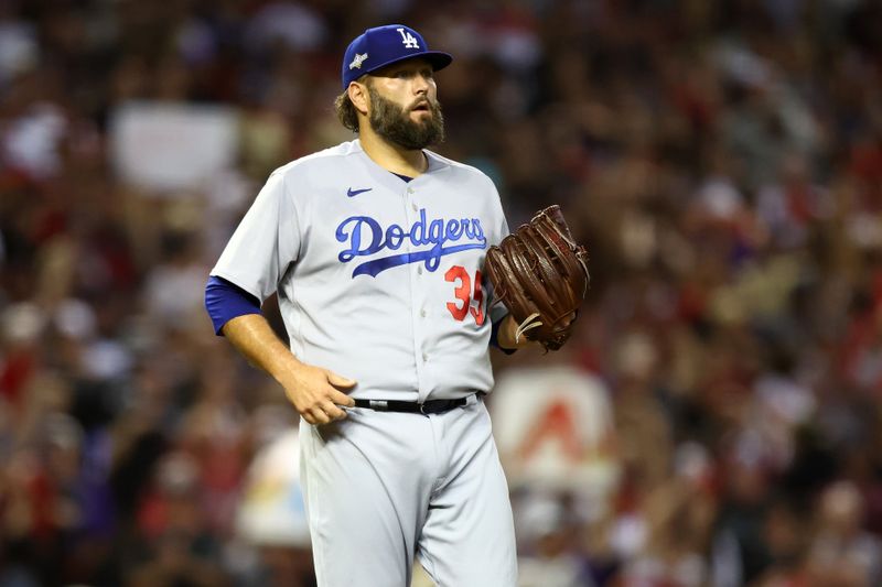 Oct 11, 2023; Phoenix, Arizona, USA; Los Angeles Dodgers starting pitcher Lance Lynn (35) reacts after giving up four home runs to the Arizona Diamondbacks in the third inning for game three of the NLDS for the 2023 MLB playoffs at Chase Field. Mandatory Credit: Mark J. Rebilas-USA TODAY Sports