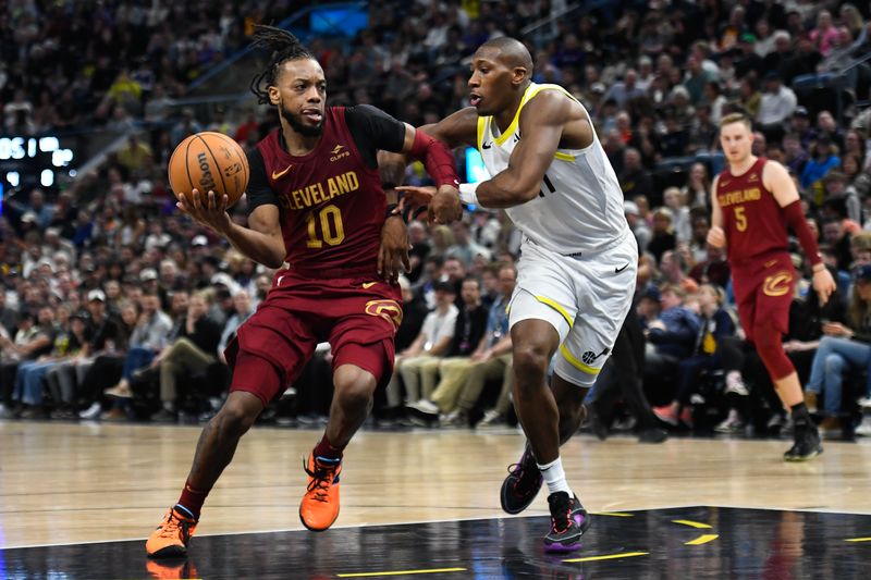 SALT LAKE CITY, UTAH - APRIL 02: Darius Garland #10 of the Cleveland Cavaliers drives against Kris Dunn #11 of the Utah Jazz during the second half of a game at Delta Center on April 02, 2024 in Salt Lake City, Utah. NOTE TO USER: User expressly acknowledges and agrees that, by downloading and or using this photograph, User is consenting to the terms and conditions of the Getty Images License Agreement. (Photo by Alex Goodlett/Getty Images)