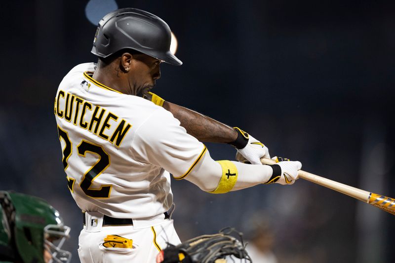 Jun 5, 2023; Pittsburgh, Pennsylvania, USA;  Pittsburgh Pirates designated hitter Andrew McCutchen (22) hits a sacrifice fly to score the winning run during the eighth inning against the Oakland Athletics at PNC Park. Mandatory Credit: Scott Galvin-USA TODAY Sports