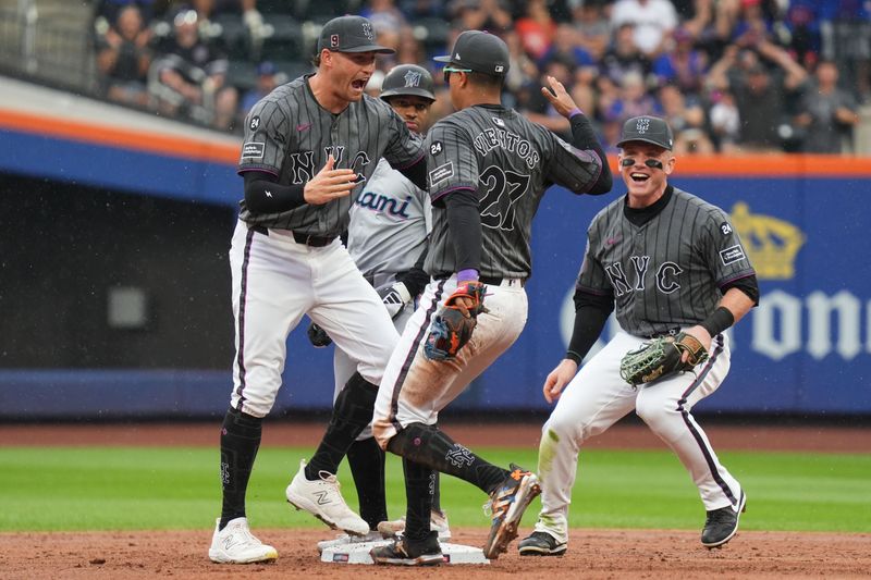 Aug 17, 2024; New York City, New York, USA; New York Mets third baseman Mark Vientos (27) celebrates with New York Mets left fielder Brandon Nimmo (9) and New York Mets center fielder Harrison Bader (44)  after tagging out Miami Marlins shortstop Xavier Edwards (63) for a double play during the 3rd inning at Citi Field. Mandatory Credit: Lucas Boland-USA TODAY Sports