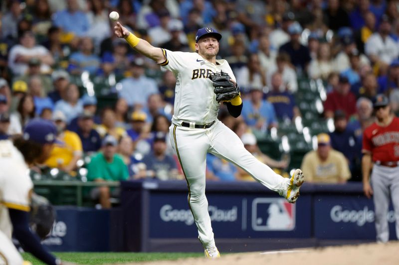 Oct 4, 2023; Milwaukee, Wisconsin, USA; Milwaukee Brewers third baseman Josh Donaldson (3) throws to first in the fourth inning against the Arizona Diamondbacks during game two of the Wildcard series for the 2023 MLB playoffs at American Family Field. Mandatory Credit: Kamil Krzaczynski-USA TODAY Sports