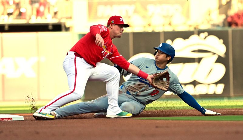 Aug 17, 2024; St. Louis, Missouri, USA; Los Angeles Dodgers designated hitter Shohei Ohtani (17) slides safely into second base as St. Louis Cardinals second baseman Nolan Gorman (16) waits on the throw at Busch Stadium in the first inning. Mandatory Credit: Tim Vizer-USA TODAY Sports