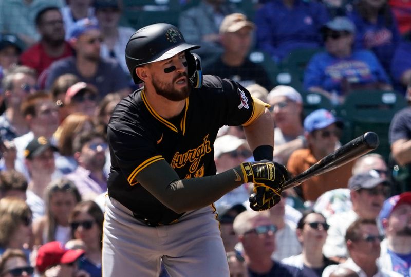 May 17, 2024; Chicago, Illinois, USA; Pittsburgh Pirates third baseman Jared Triolo (19) hits a two-run single against the Chicago Cubs during the fourth inning at Wrigley Field. Mandatory Credit: David Banks-USA TODAY Sports