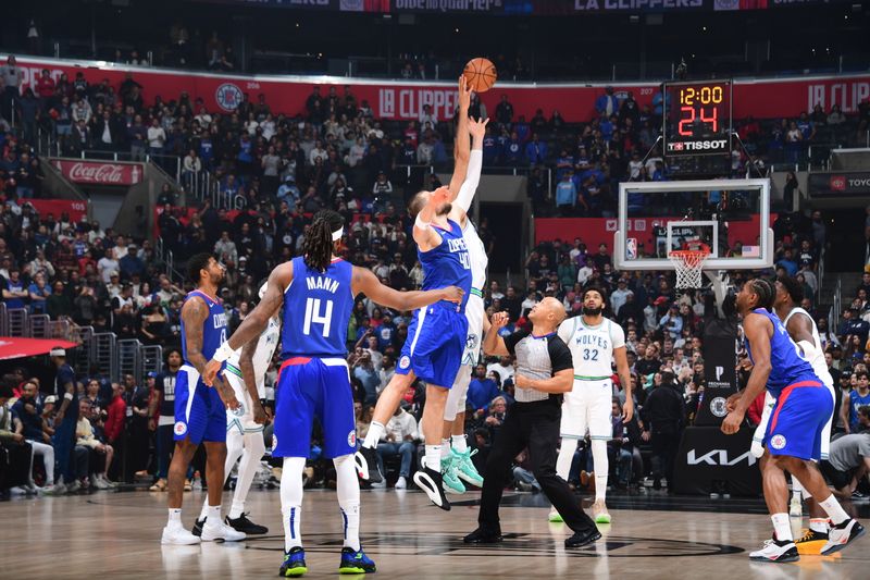 LOS ANGELES, CA - FEBRUARY 12:  Opening tip-off between Ivica Zubac #40 of the LA Clippers & Rudy Gobert #27 of the Minnesota Timberwolves on February 12, 2024 at Crypto.Com Arena in Los Angeles, California. NOTE TO USER: User expressly acknowledges and agrees that, by downloading and/or using this Photograph, user is consenting to the terms and conditions of the Getty Images License Agreement. Mandatory Copyright Notice: Copyright 2024 NBAE (Photo by Adam Pantozzi/NBAE via Getty Images)