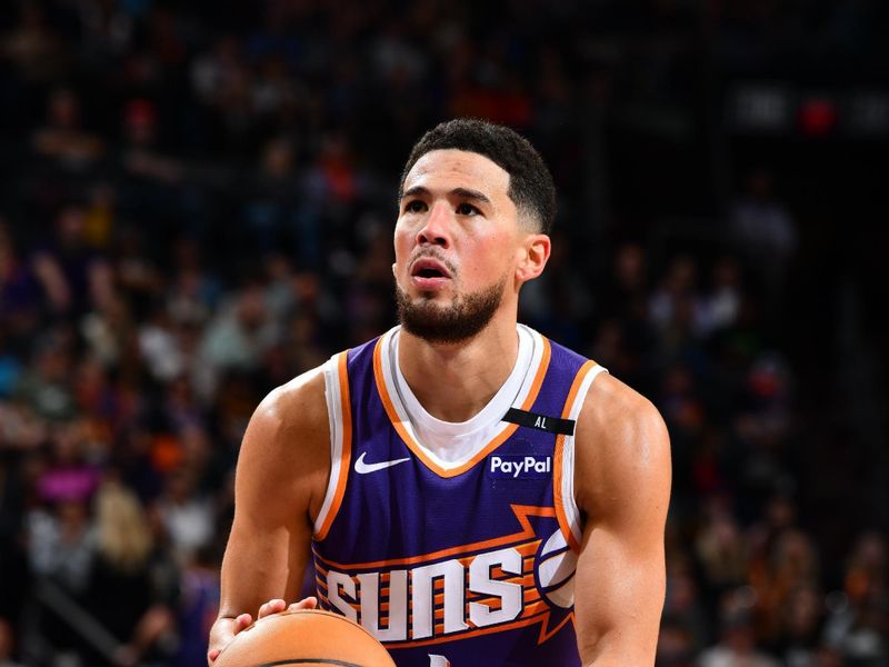 PHOENIX, AZ - NOVEMBER 27: Devin Booker #1 of the Phoenix Suns shoots a free throw during the game against the Brooklyn Nets on November 27, 2024 at Footprint Center in Phoenix, Arizona. NOTE TO USER: User expressly acknowledges and agrees that, by downloading and or using this photograph, user is consenting to the terms and conditions of the Getty Images License Agreement. Mandatory Copyright Notice: Copyright 2024 NBAE (Photo by Barry Gossage/NBAE via Getty Images)