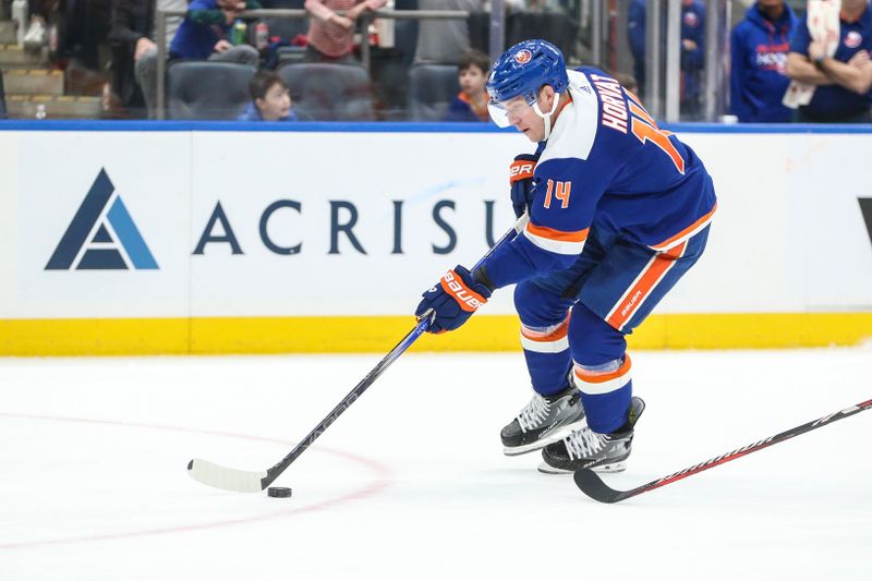 Feb 10, 2024; Elmont, New York, USA;  New York Islanders center Bo Horvat (14) skates down ice on a breakaway in the second period against the Calgary Flames at UBS Arena. Mandatory Credit: Wendell Cruz-USA TODAY Sports