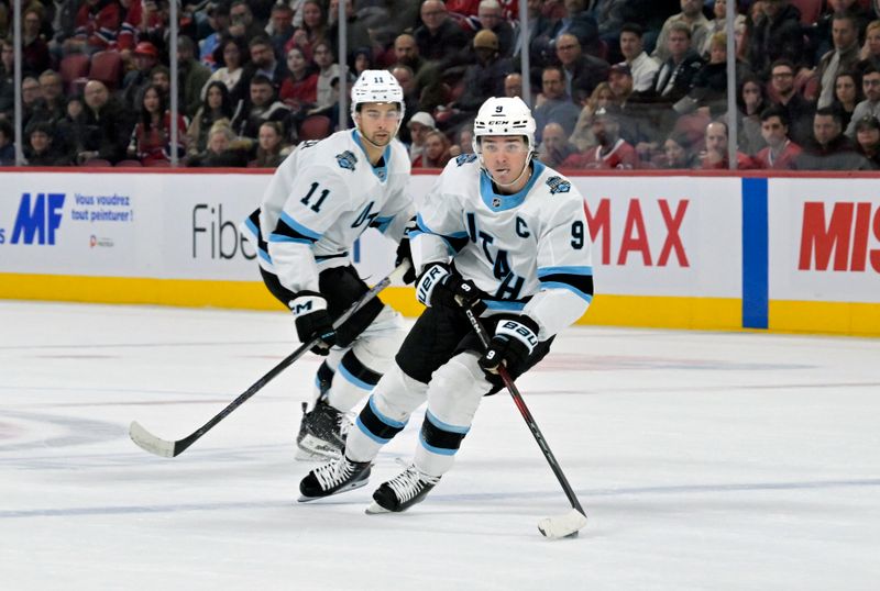 Nov 26, 2024; Montreal, Quebec, CAN; Utah Hockey Club forward Clayton Keller (9) plays the puck during the overtime period of the game against the Montreal Canadiens at the Bell Centre. Mandatory Credit: Eric Bolte-Imagn Images