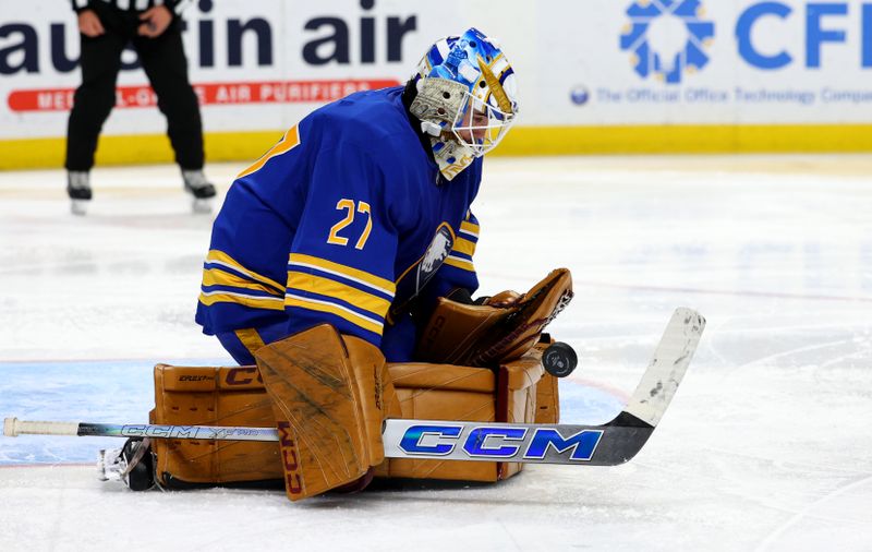 Nov 14, 2024; Buffalo, New York, USA;  Buffalo Sabres goaltender Devon Levi (27) makes a save during the third period against the St. Louis Blues at KeyBank Center. Mandatory Credit: Timothy T. Ludwig-Imagn Images