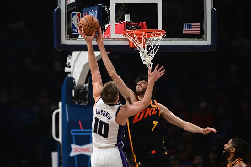 OKLAHOMA CITY, OKLAHOMA - FEBRUARY 11: Chet Holmgren #7 of the Oklahoma City Thunder goes up to block the shot of Domantas Sabonis #10 of the Sacramento Kings during the first half at Paycom Center on February 11, 2024 in Oklahoma City, Oklahoma. NOTE TO USER: User expressly acknowledges and agrees that, by downloading and or using this Photograph, user is consenting to the terms and conditions of the Getty Images License Agreement. (Photo by Joshua Gateley/Getty Images)