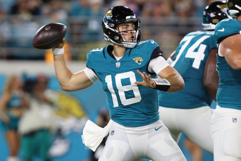 Jacksonville Jaguars quarterback Nathan Rourke (18) stands back to pass during the second half of an NFL preseason football game against the Miami Dolphins, Saturday, Aug. 26, 2023, in Jacksonville, Fla. (AP Photo/Gary McCullough)