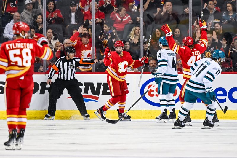 Feb 15, 2024; Calgary, Alberta, CAN; Calgary Flames center Nazem Kadri (91) celebrates after scoring a goal against the San Jose Sharks during the first period at Scotiabank Saddledome. Mandatory Credit: Brett Holmes-USA TODAY Sports