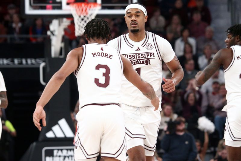 Jan 27, 2024; Starkville, Mississippi, USA; Mississippi State Bulldogs forward Tolu Smith (1) reacts with Mississippi State Bulldogs guard Shakeel Moore (3) during the first half against the Auburn Tigers at Humphrey Coliseum. Mandatory Credit: Petre Thomas-USA TODAY Sports