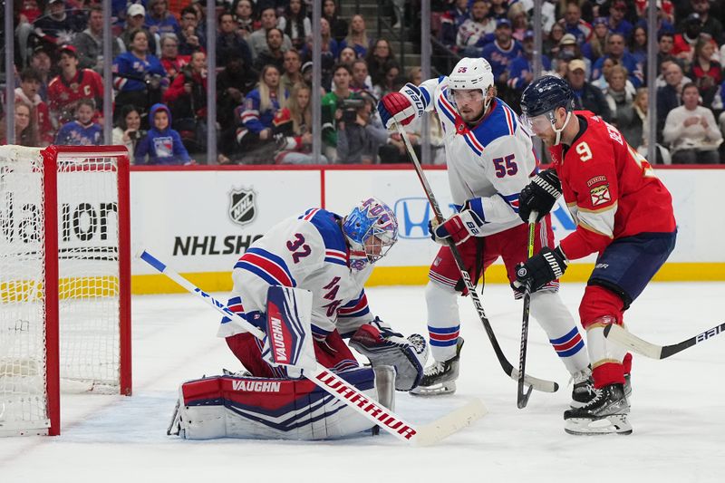 Dec 29, 2023; Sunrise, Florida, USA; New York Rangers goaltender Jonathan Quick (32) stops the shot of Florida Panthers center Sam Bennett (9) during the second period at Amerant Bank Arena. Mandatory Credit: Jasen Vinlove-USA TODAY Sports