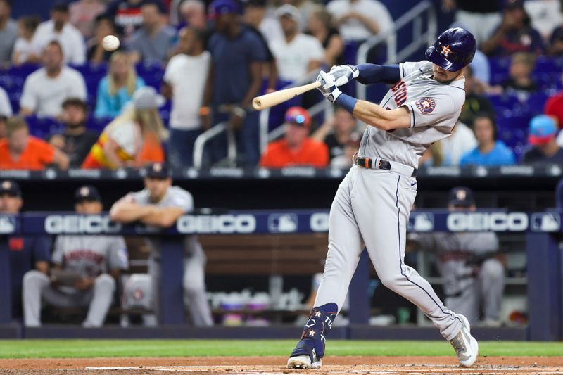 Aug 15, 2023; Miami, Florida, USA; Houston Astros right fielder Kyle Tucker (30) hits a single against the Miami Marlins during the first inning at loanDepot Park. Mandatory Credit: Sam Navarro-USA TODAY Sports