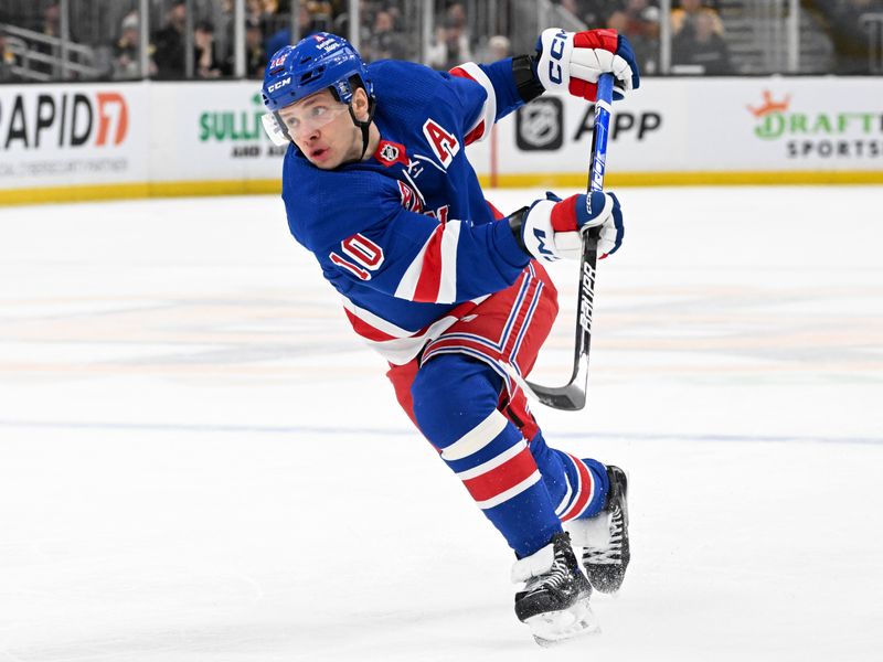 Mar 21, 2024; Boston, Massachusetts, USA; New York Rangers left wing Artemi Panarin (10) takes a shot against the Boston Bruins during the second period at the TD Garden. Mandatory Credit: Brian Fluharty-USA TODAY Sports