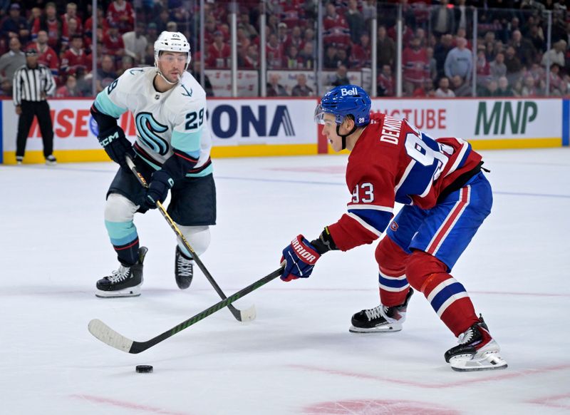 Oct 14, 2025; Montreal, Quebec, CAN; Montreal Canadiens forward Ivan Demidov (93) plays the puck and Seattle Kraken defenseman Vince Dunn (29) defends during the overtime period at the Bell Centre. Mandatory Credit: Eric Bolte-Imagn Images