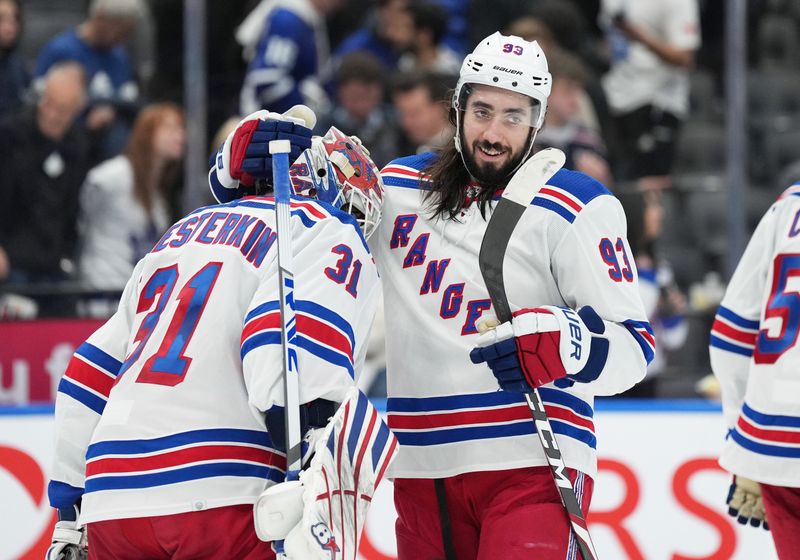 Dec 19, 2023; Toronto, Ontario, CAN; New York Rangers center Mika Zibanejad (93) celebrates the win with s goaltender Igor Shesterkin (31) against the Toronto Maple Leafs at the end of the third period at Scotiabank Arena. Mandatory Credit: Nick Turchiaro-USA TODAY Sports