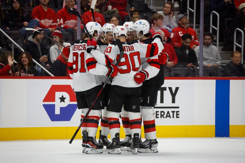 Nov 29, 2024; Detroit, Michigan, USA; The New Jersey Devils celebrate a goal scored in the first period at Little Caesars Arena. Mandatory Credit: Brian Bradshaw Sevald-Imagn Images