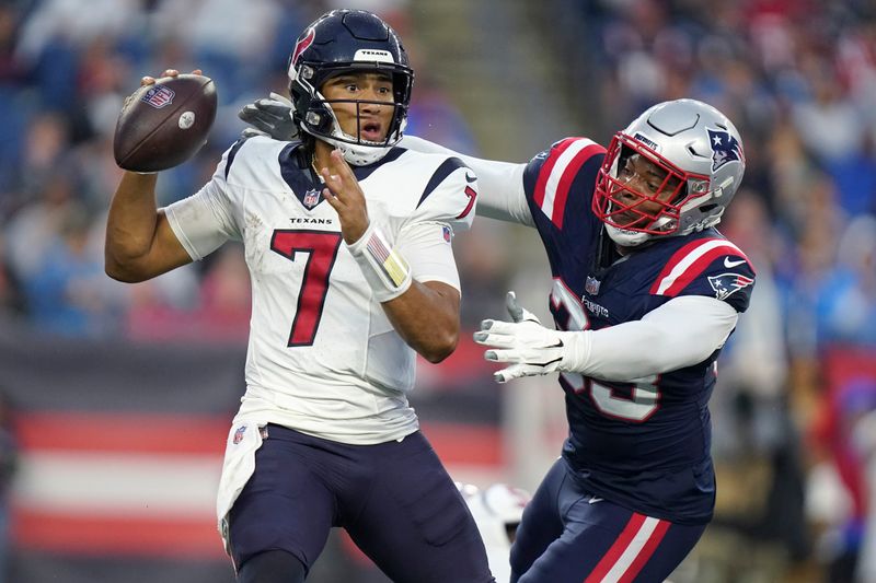 New England Patriots linebacker Anfernee Jennings, right, reaches for Houston Texans quarterback C.J. Stroud (7) during the first half of an NFL preseason football game Thursday, Aug. 10, 2023, in Foxborough, Mass. (AP Photo/Steven Senne)