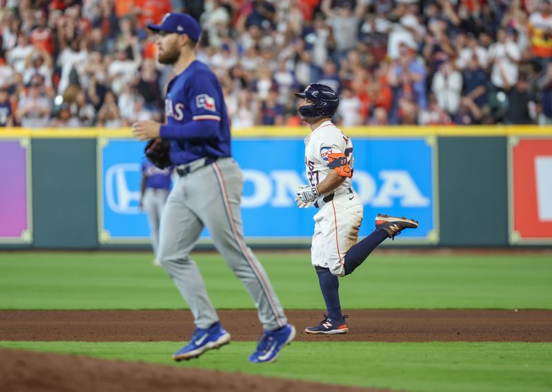 Apr 13, 2024; Houston, Texas, USA; Houston Astros second base Jose Altuve (27) hits a two-run RBI double against the Texas Rangers in the seventh inning at Minute Maid Park. Mandatory Credit: Thomas Shea-USA TODAY Sports