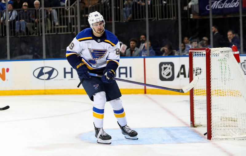Nov 25, 2024; New York, New York, USA; St. Louis Blues left wing Pavel Buchnevich (89) scores an empty net goal against the New York Rangers during the third period at Madison Square Garden. Mandatory Credit: Danny Wild-Imagn Images
