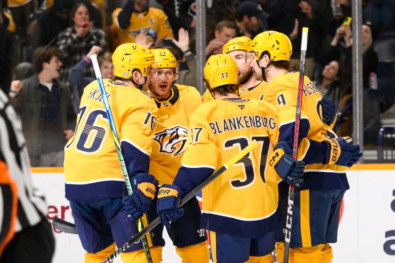 Nov 27, 2024; Nashville, Tennessee, USA;  Nashville Predators center Ryan O'Reilly (90) celebrates after his goal with his teammates against the Philadelphia Flyers during the first period at Bridgestone Arena. Mandatory Credit: Steve Roberts-Imagn Images