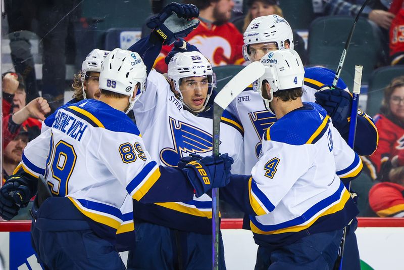 Jan 23, 2024; Calgary, Alberta, CAN; St. Louis Blues center Jordan Kyrou (25) celebrates his goal with teammates against the Calgary Flames during the third period at Scotiabank Saddledome. Mandatory Credit: Sergei Belski-USA TODAY Sports