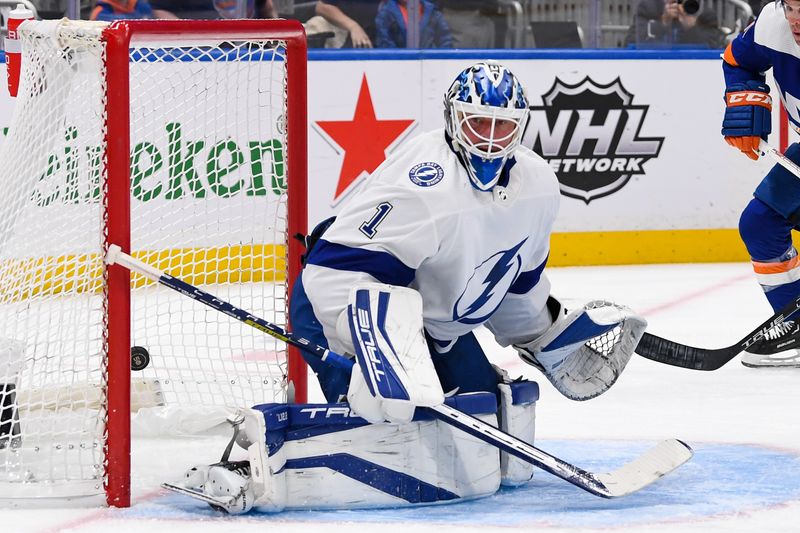 Apr 6, 2023; Elmont, New York, USA; Tampa Bay Lightning goaltender Brian Elliott (1) reacts to a goal by  New York Islanders defenseman Adam Pelech (3) during the second period at UBS Arena. Mandatory Credit: Dennis Schneidler-USA TODAY Sports