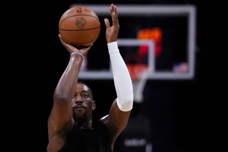 MIAMI, FLORIDA - JANUARY 27: Bam Adebayo #13 of the Miami Heat warms up prior to a game against the Orlando Magic at Kaseya Center on January 27, 2025 in Miami, Florida. NOTE TO USER: User expressly acknowledges and agrees that, by downloading and or using this photograph, User is consenting to the terms and conditions of the Getty Images License Agreement. (Photo by Rich Storry/Getty Images)