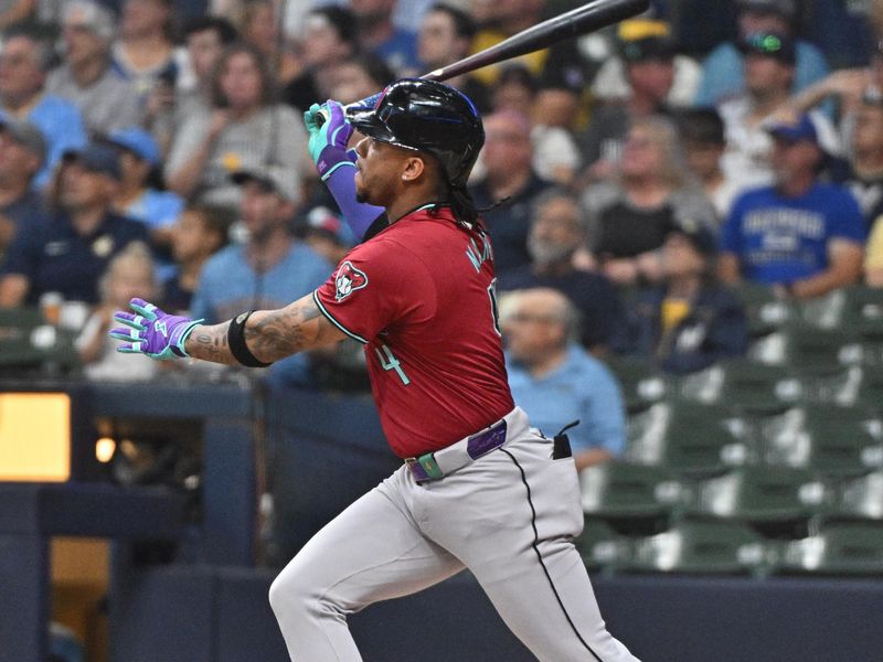 Sep 20, 2024; Milwaukee, Wisconsin, USA; Arizona Diamondbacks second base Ketel Marte (4) hits a home run against the Milwaukee Brewers in the first inning at American Family Field. Mandatory Credit: Michael McLoone-Imagn Images